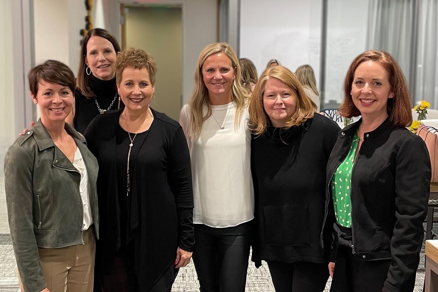 Sheri Welsh posing with hiring managers she works with